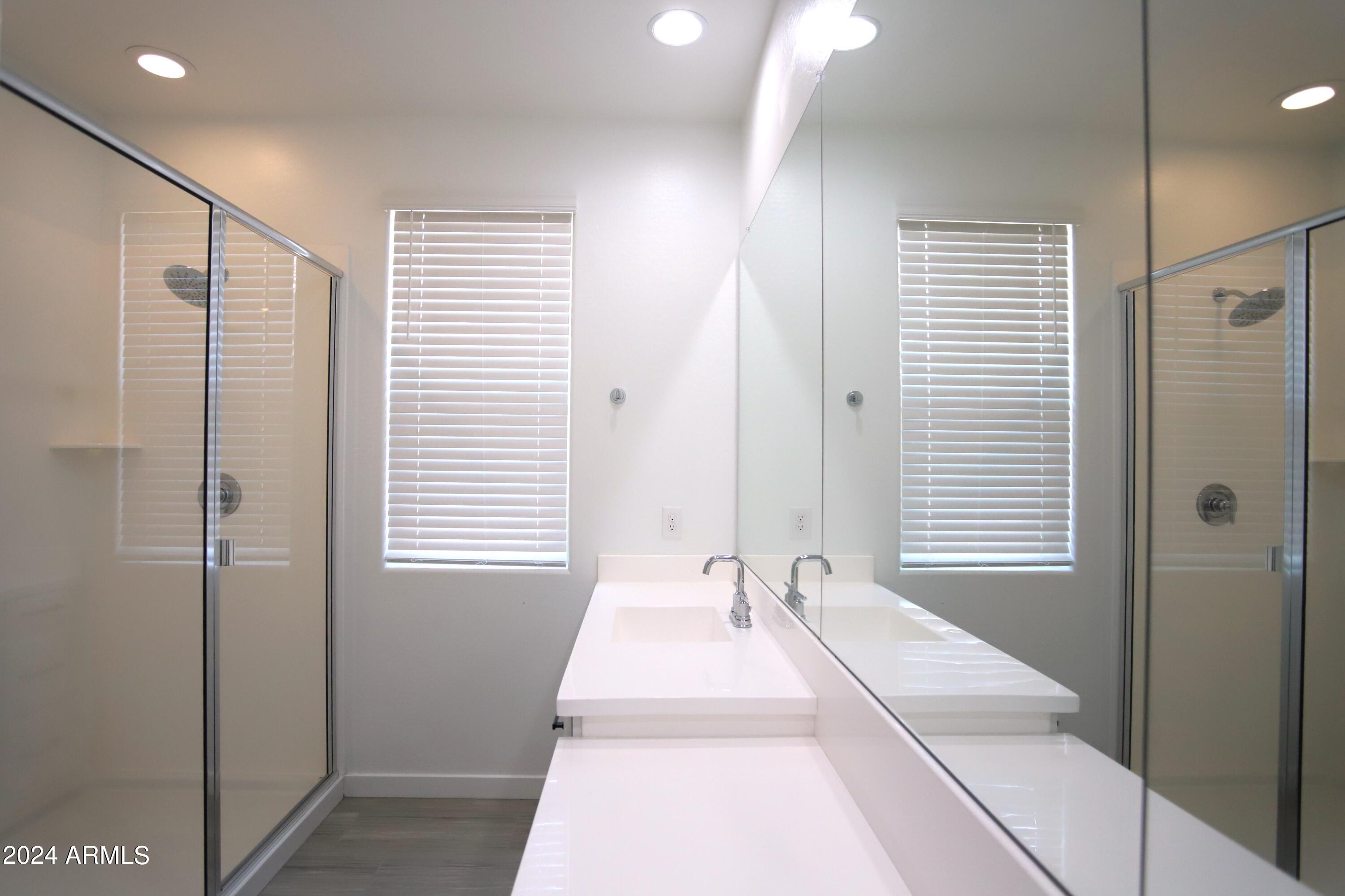 1651 West Piedmont Road Phoenix, AZ 85041 - Photo 31 of 46 a spacious bathroom with a bathtub and a shower