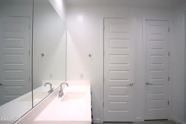 a bathroom with a bathtub and a sink