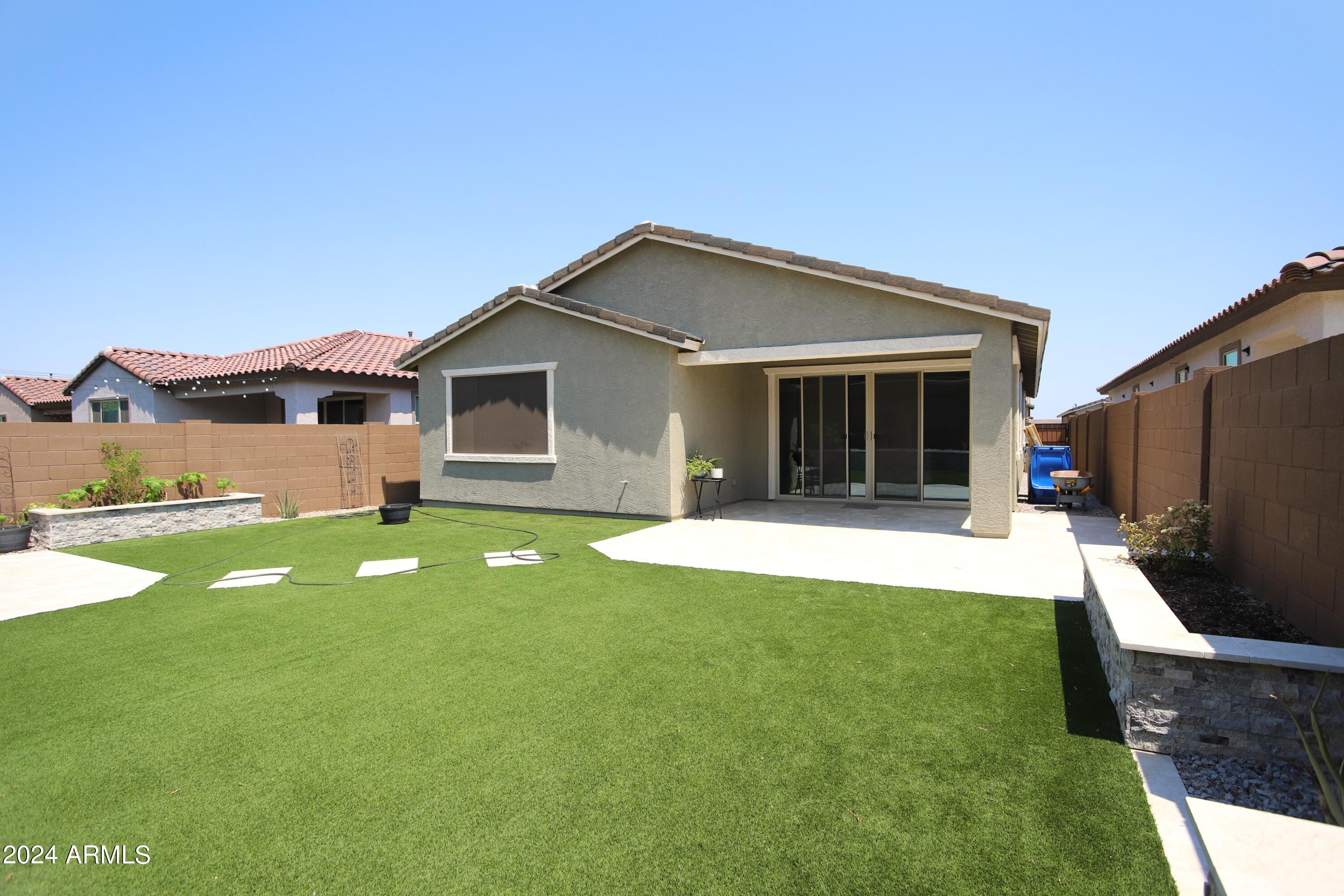 1651 West Piedmont Road Phoenix, AZ 85041 - Photo 37 of 46 a front view of a house with garden
