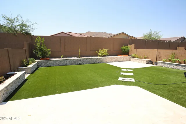 a view of a backyard with a garden