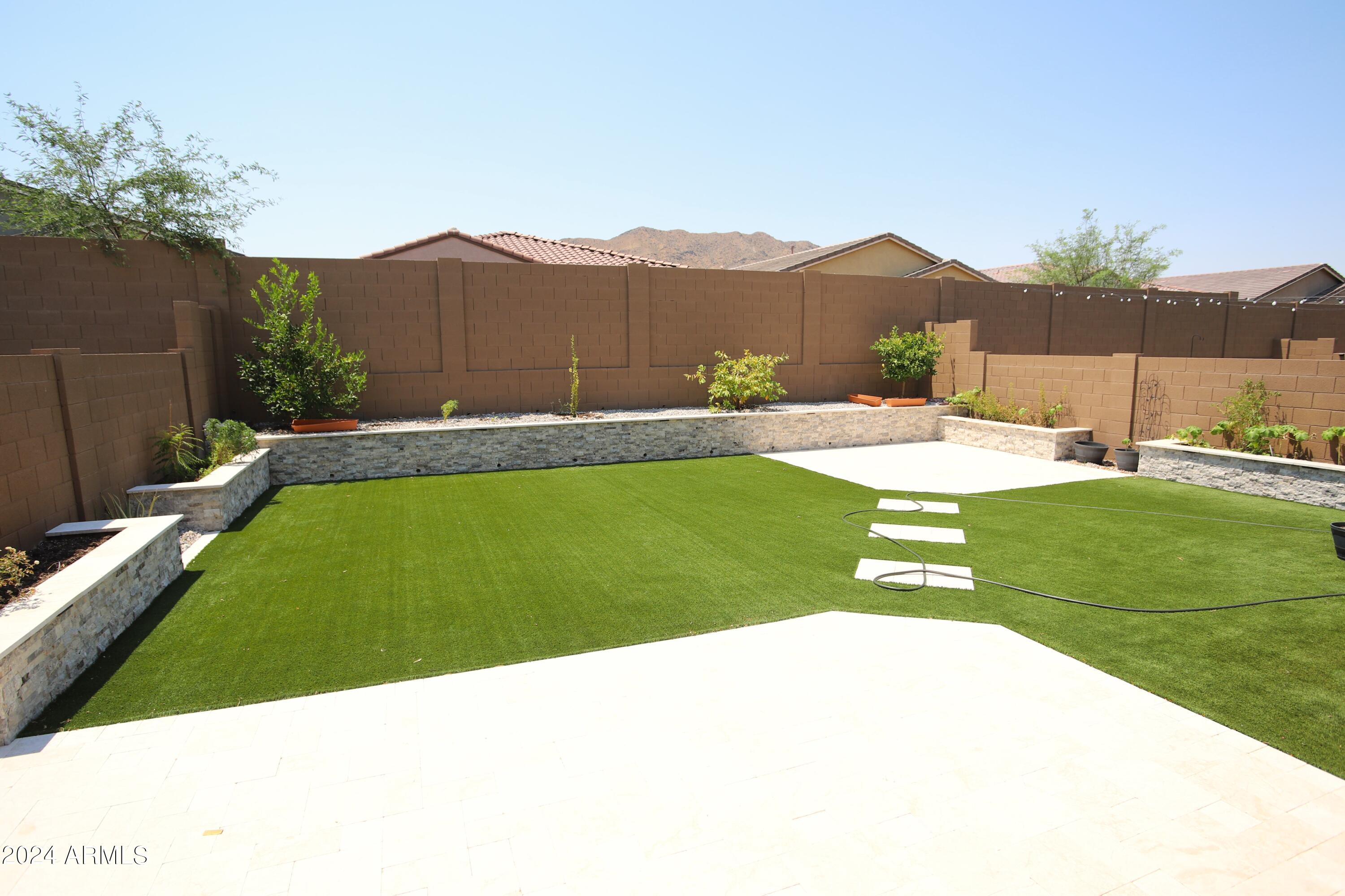 1651 West Piedmont Road Phoenix, AZ 85041 - Photo 39 of 46 a view of a backyard with a garden