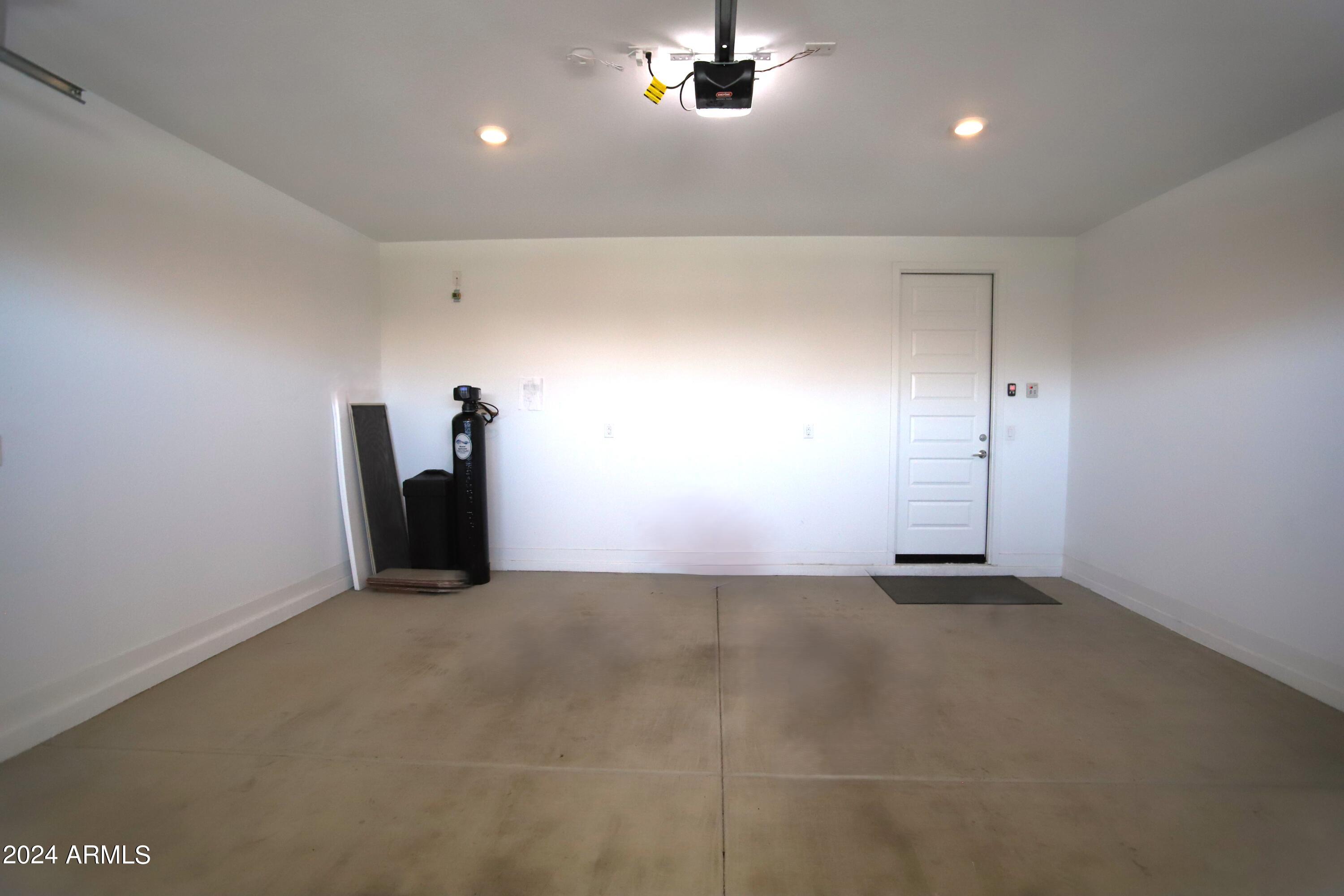 1651 West Piedmont Road Phoenix, AZ 85041 - Photo 41 of 46 an empty room with chandelier fan and windows