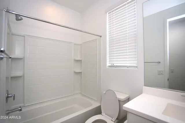 a bathroom with a toilet and a bathtub