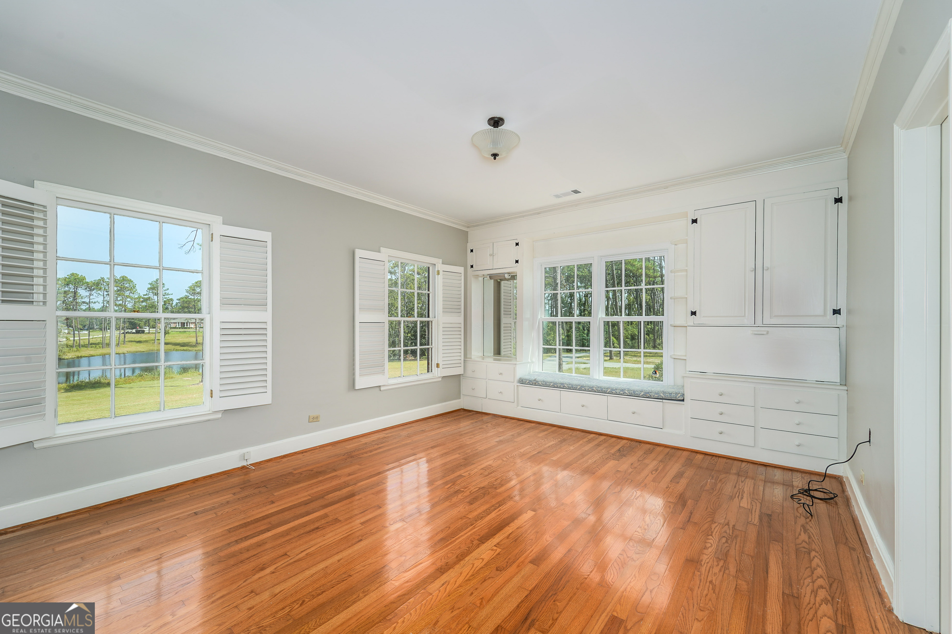 1602 Ward St Extension West Douglas, GA 31533 - Photo 43 of 70 a view of an empty room with a window and wooden floor