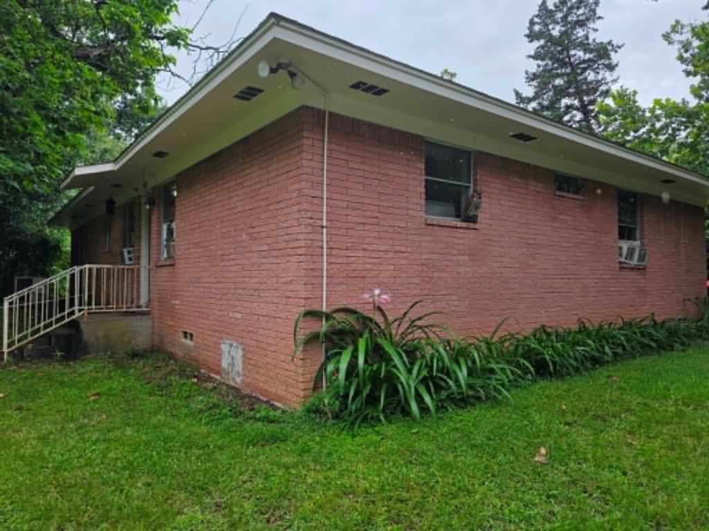 4514 West Loop 281 Longview, TX 75604 - Photo 4 of 36 Brick exterior with a covered entry