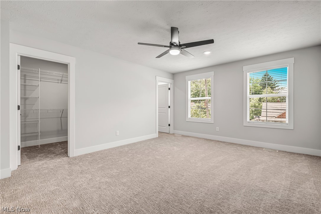 1021 Learidge Road Lyndhurst, OH 44124 - Photo 8 of 15 Unfurnished bedroom with carpet, a closet, and ceiling fan