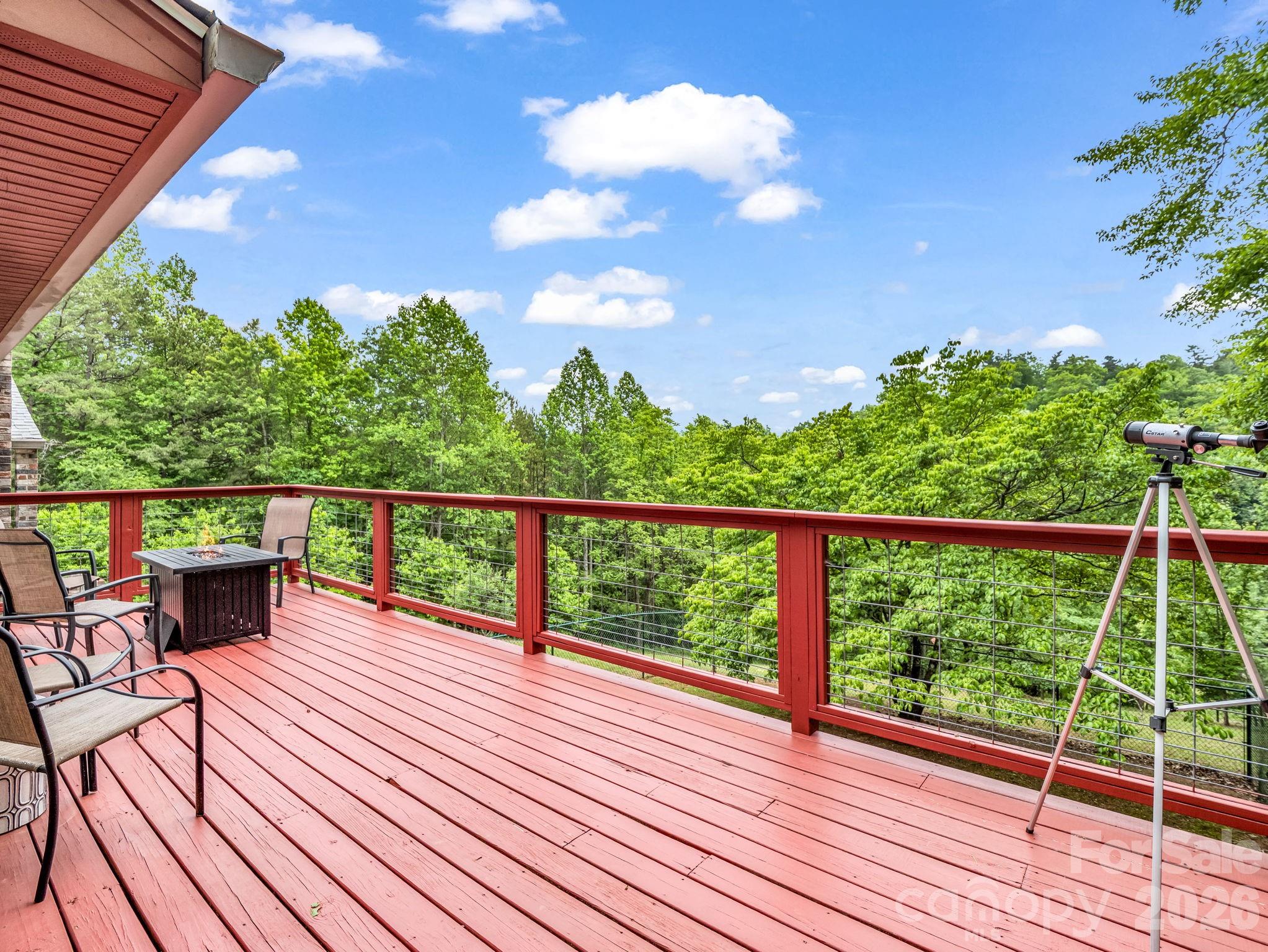 656 Cashiers Valley Road Brevard, NC 28712 - Photo 30 of 37 a view of roof deck with wooden floor and seating space