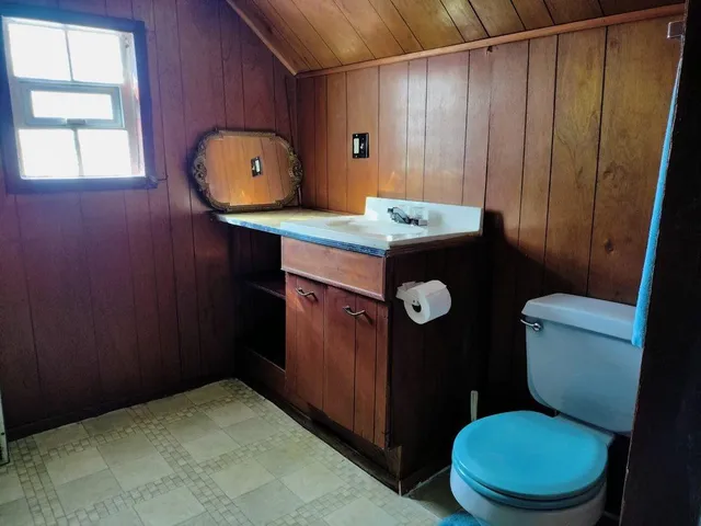 an empty room with a rug