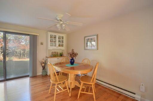 195 Falmouth Road, Unit 14C Mashpee, MA 02649 - Photo 12 of 27 a dining room with furniture and window