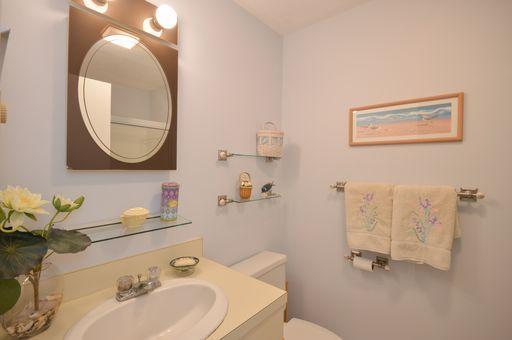 195 Falmouth Road, Unit 14C Mashpee, MA 02649 - Photo 21 of 27 a bathroom with a sink and a mirror