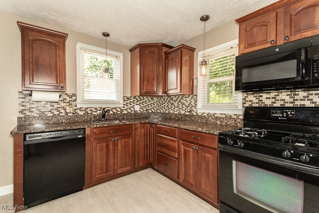 1346 Belrose Road Cleveland, OH 44124 - Photo 10 of 37 Beautiful wood cabinets with updated hardware, granite countertops and matching appliances