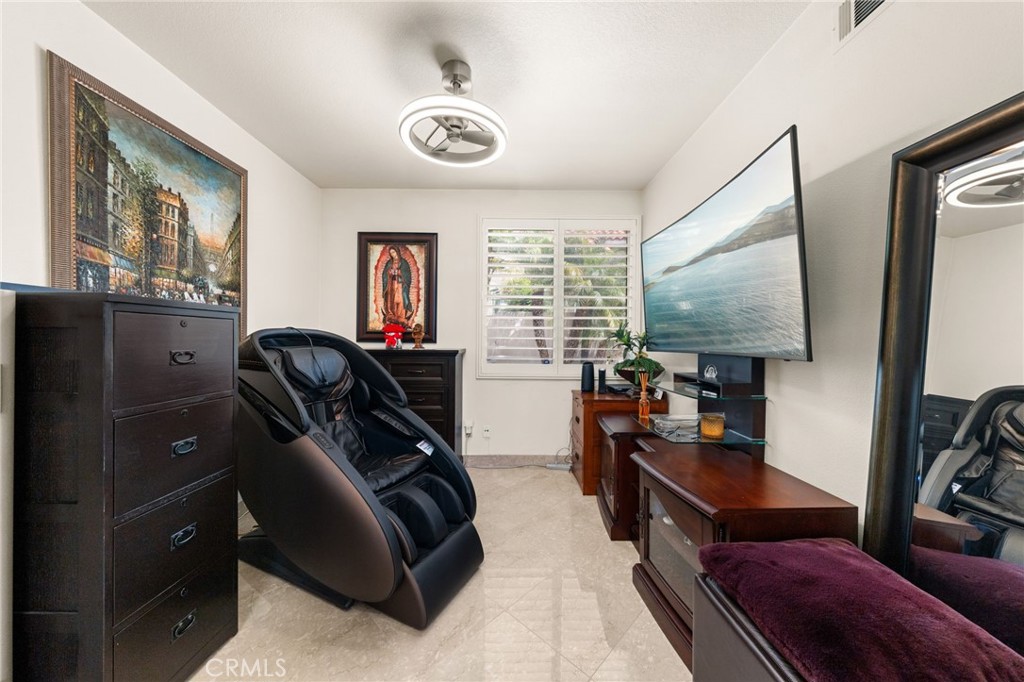 950 Chantel Drive Corona, CA 92879 - Photo 12 of 27 a living room with furniture and a flat screen tv