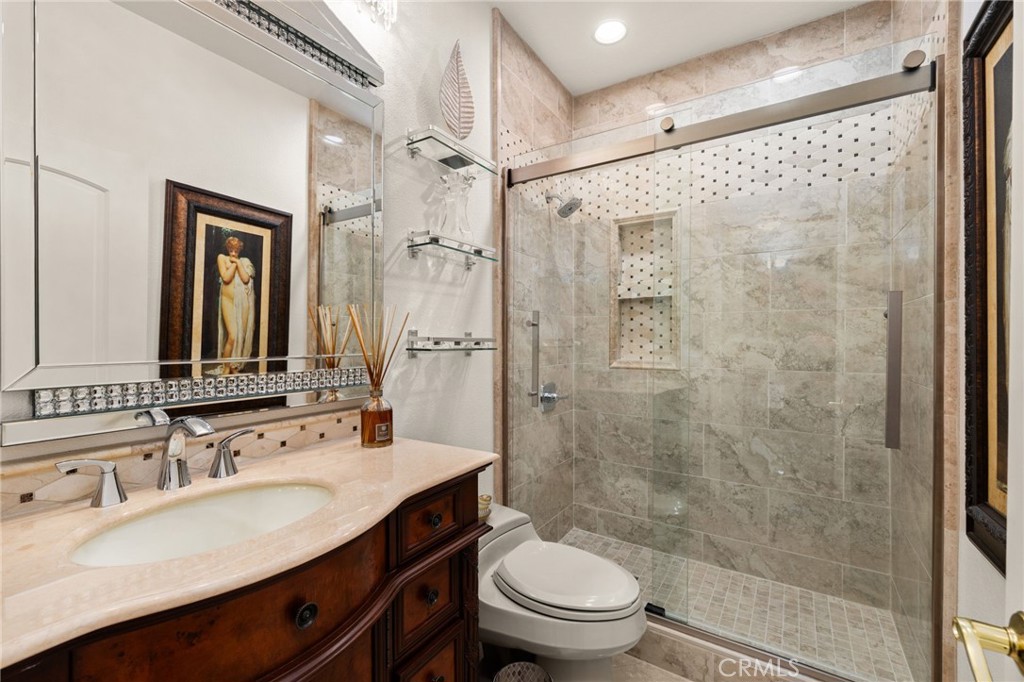 950 Chantel Drive Corona, CA 92879 - Photo 13 of 27 a bathroom with a sink a toilet and shower