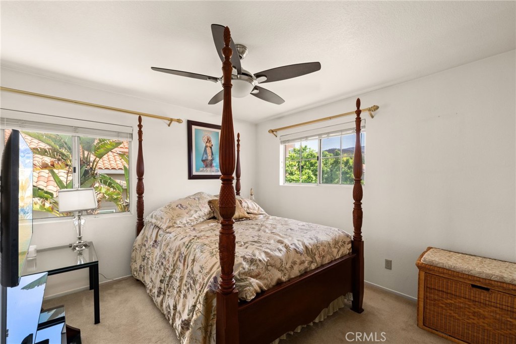 950 Chantel Drive Corona, CA 92879 - Photo 16 of 27 a bedroom with a bed and a window