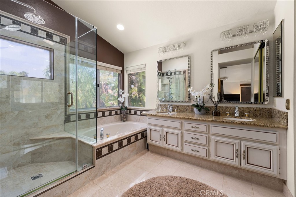 950 Chantel Drive Corona, CA 92879 - Photo 21 of 27 a bathroom with a tub sink shower and mirror