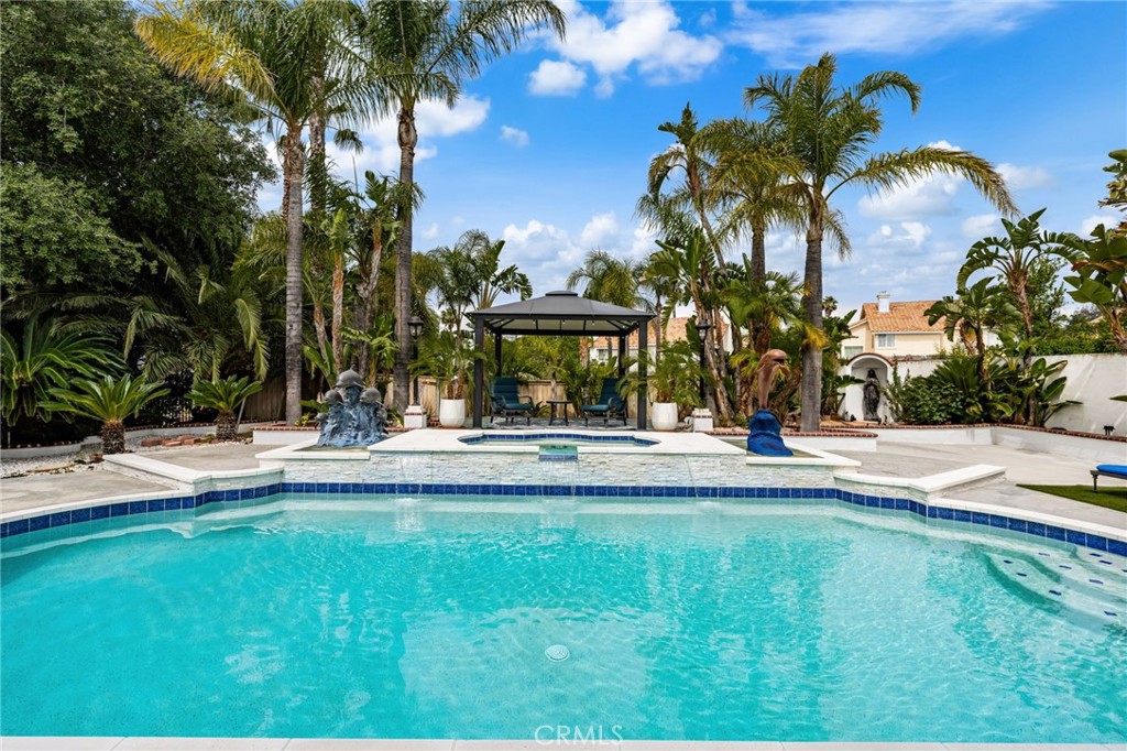 950 Chantel Drive Corona, CA 92879 - Photo 23 of 27 a view of swimming pool with lawn chairs and plants