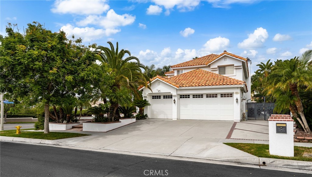 950 Chantel Drive Corona, CA 92879 - Photo 3 of 27 a front view of a house with a yard