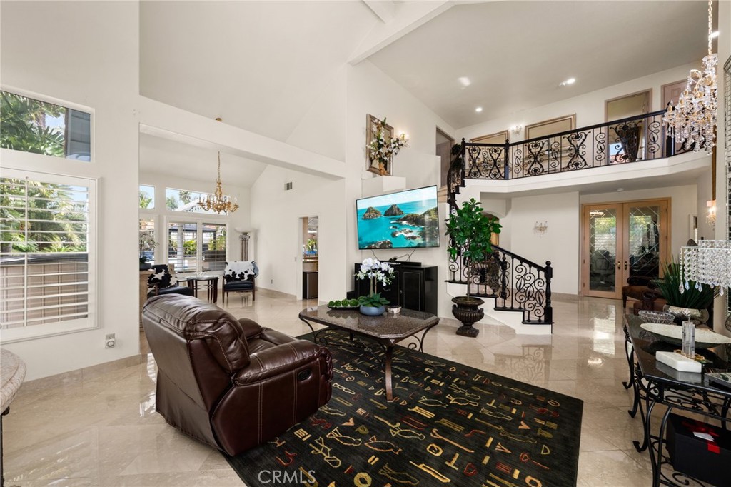 950 Chantel Drive Corona, CA 92879 - Photo 6 of 27 a living room with furniture a large window and a fireplace