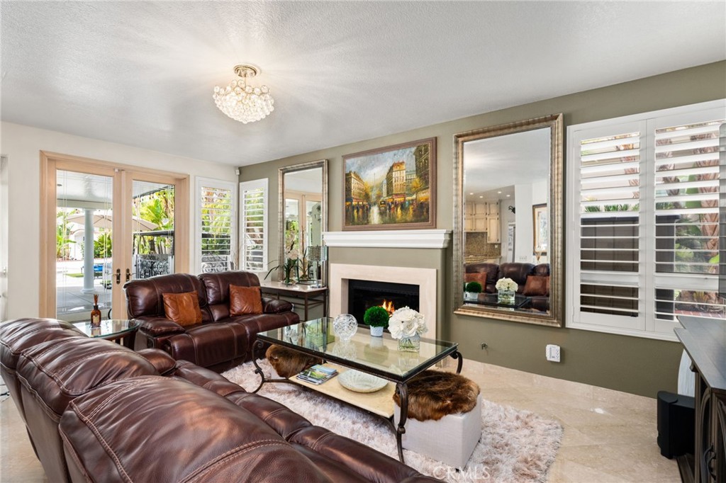 950 Chantel Drive Corona, CA 92879 - Photo 8 of 27 a living room with furniture and a fireplace
