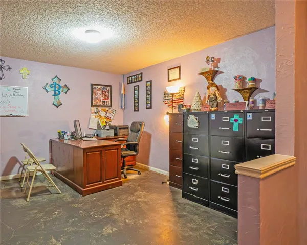 a view of a workspace with furniture