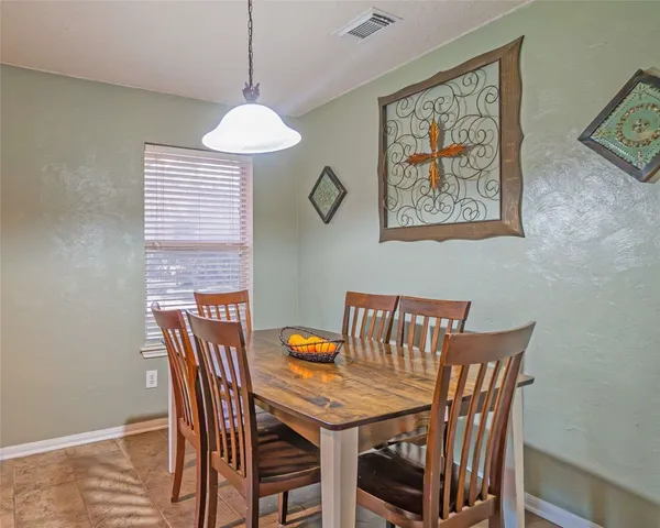a view of a dining room with furniture