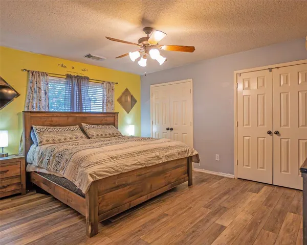 a bedroom with a bed and window
