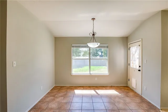 a view of empty room with windows