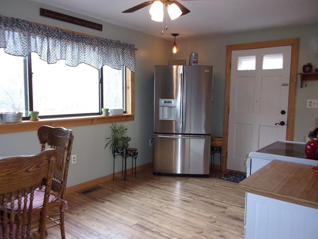 158 Osborne Road Ware, MA 01082 - Photo 11 of 31 a view of a kitchen with a window and wooden floor