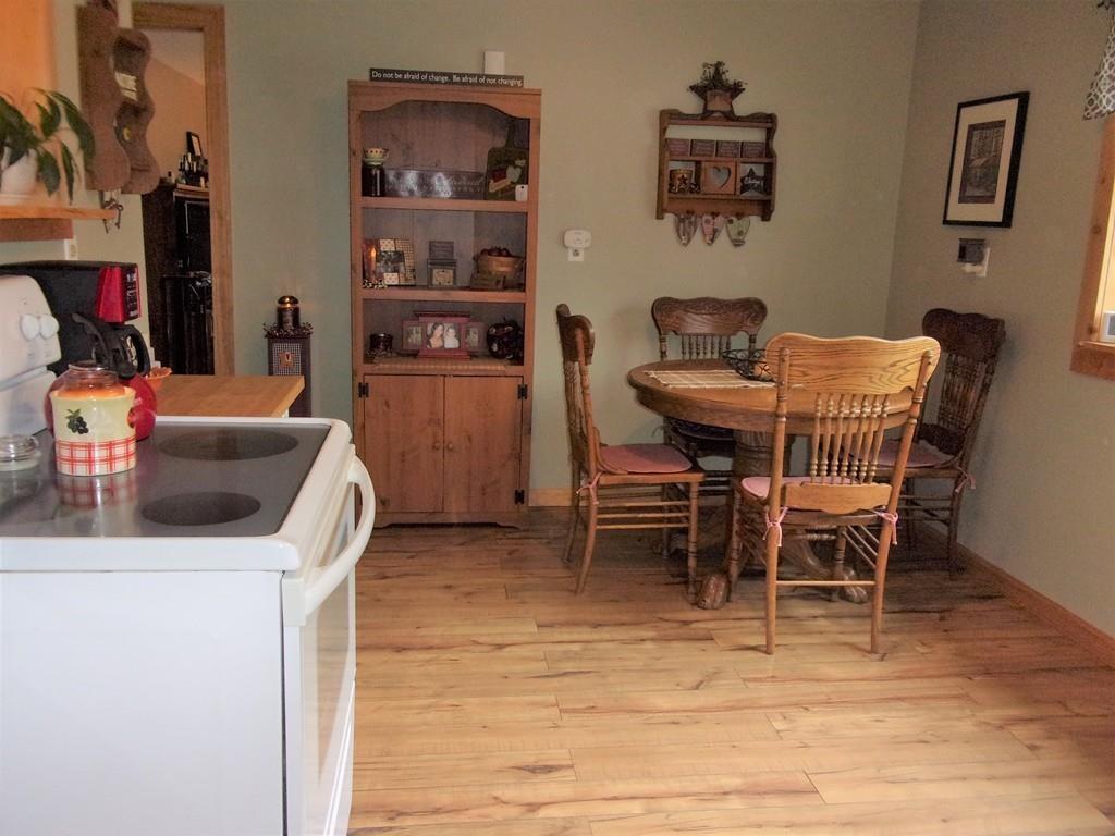 158 Osborne Road Ware, MA 01082 - Photo 15 of 31 a dining room with furniture and wooden floor