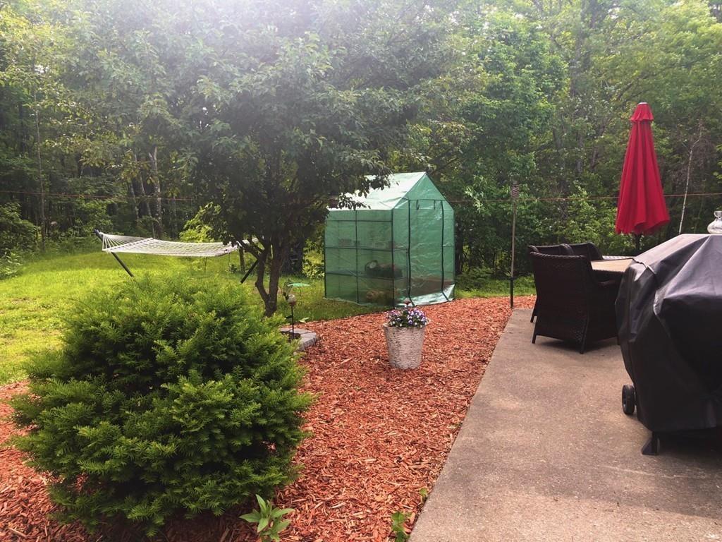 158 Osborne Road Ware, MA 01082 - Photo 2 of 31 a backyard of a house with table and chairs