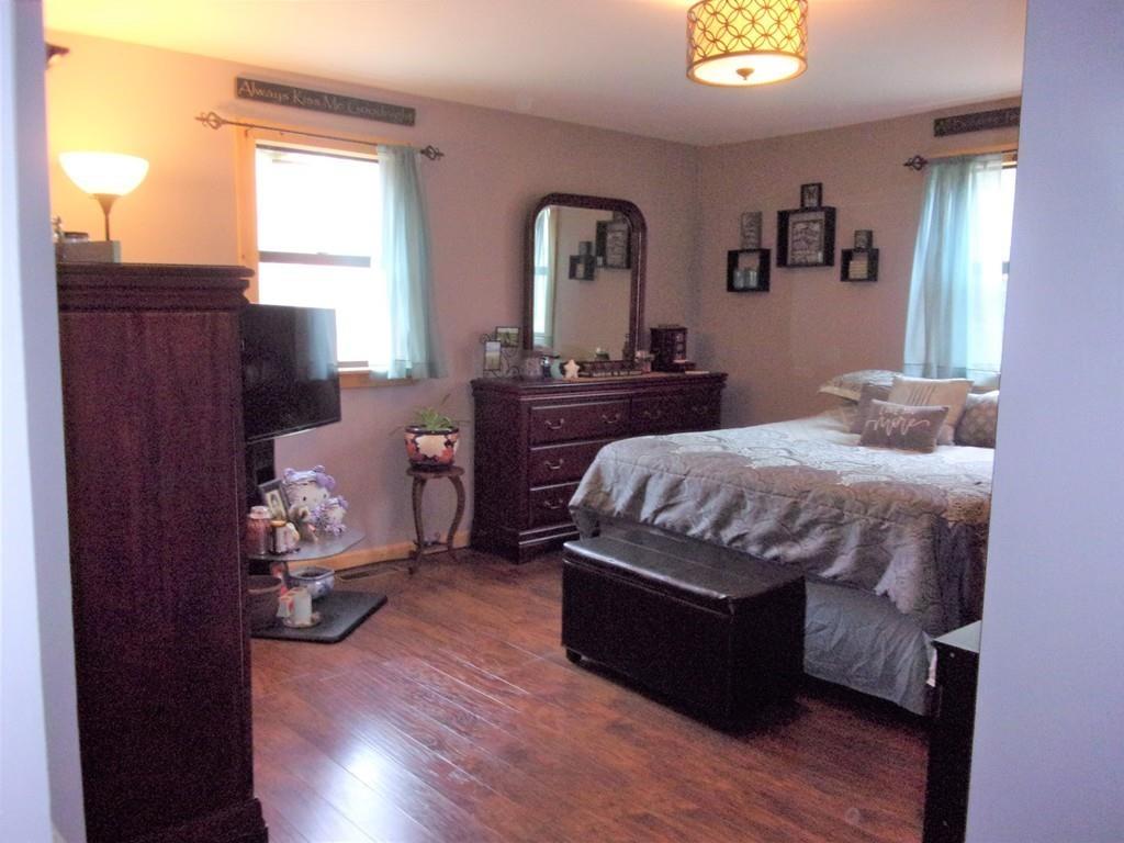 158 Osborne Road Ware, MA 01082 - Photo 21 of 31 a bedroom with a bed and wooden floor