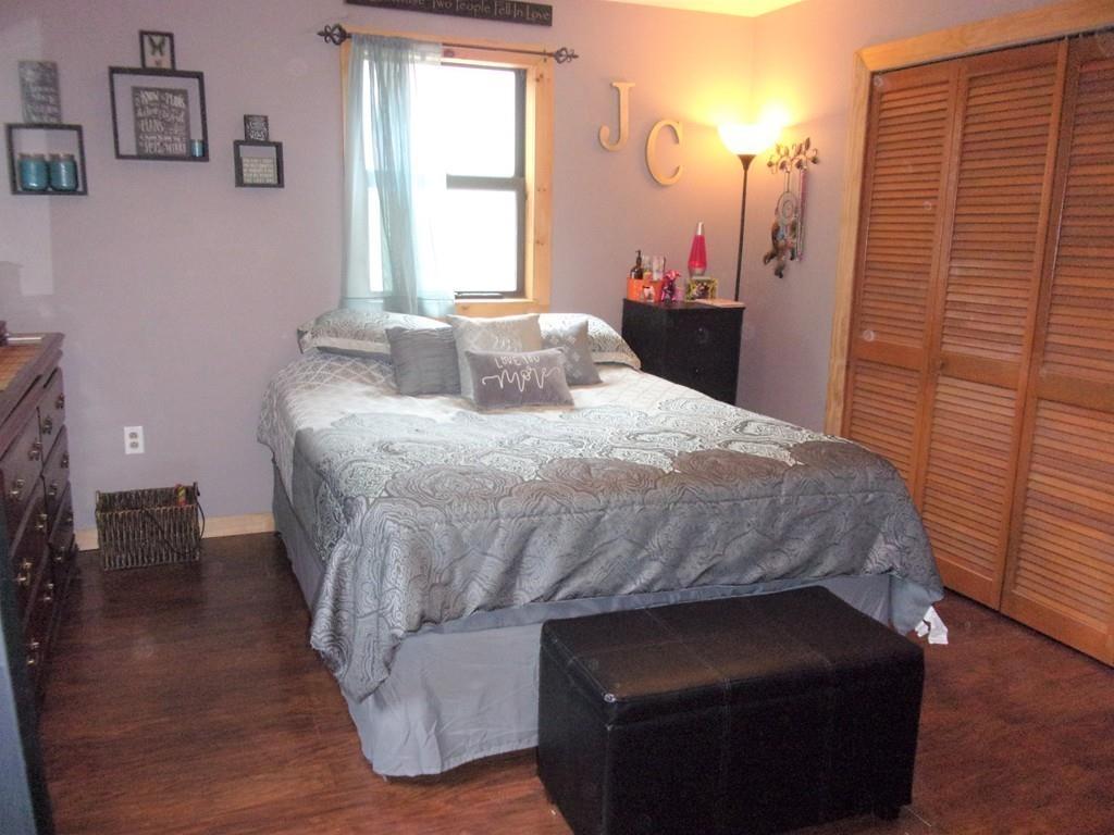 158 Osborne Road Ware, MA 01082 - Photo 22 of 31 a bedroom with a bed and wooden floor