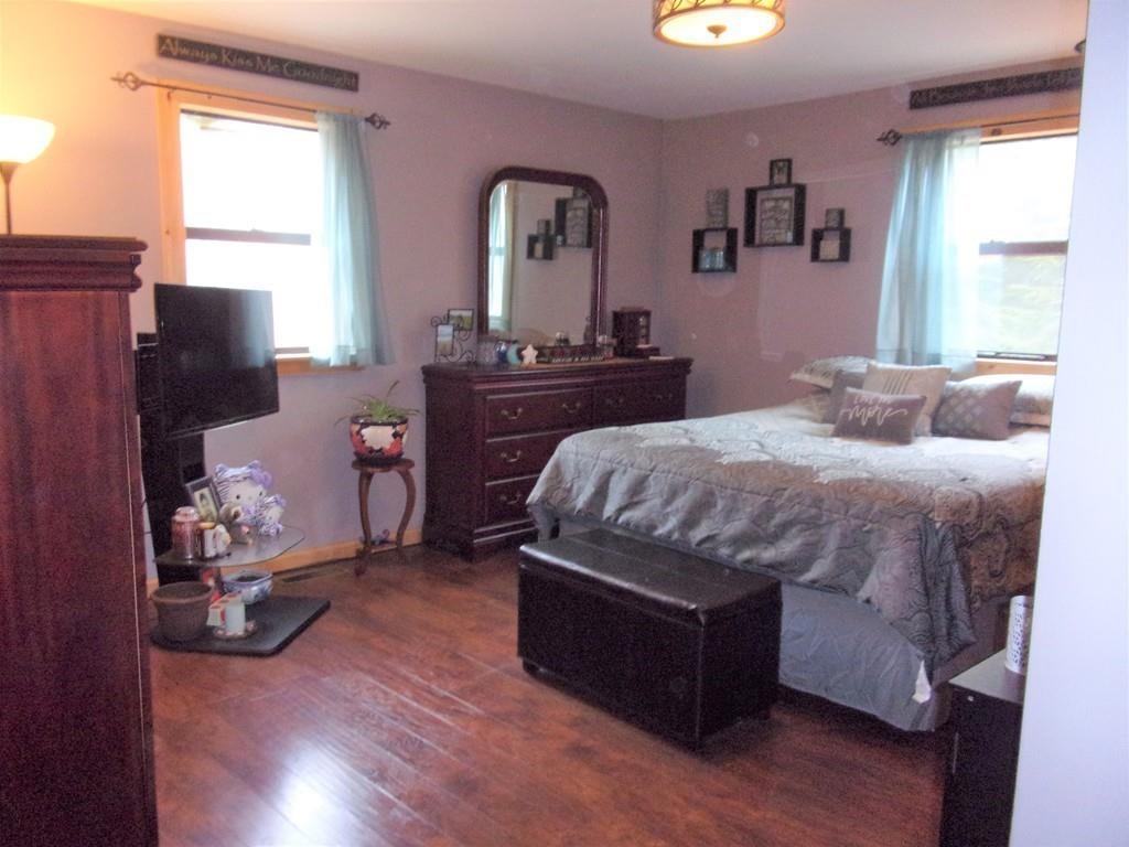 158 Osborne Road Ware, MA 01082 - Photo 24 of 31 a bedroom with a bed and wooden floor