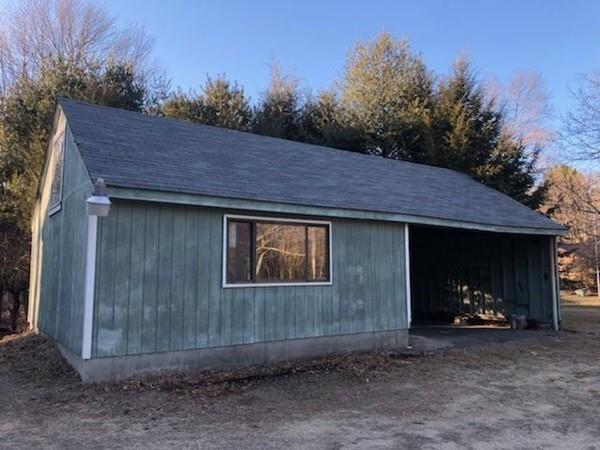 158 Osborne Road Ware, MA 01082 - Photo 5 of 31 a view of a house with a yard and wooden fence