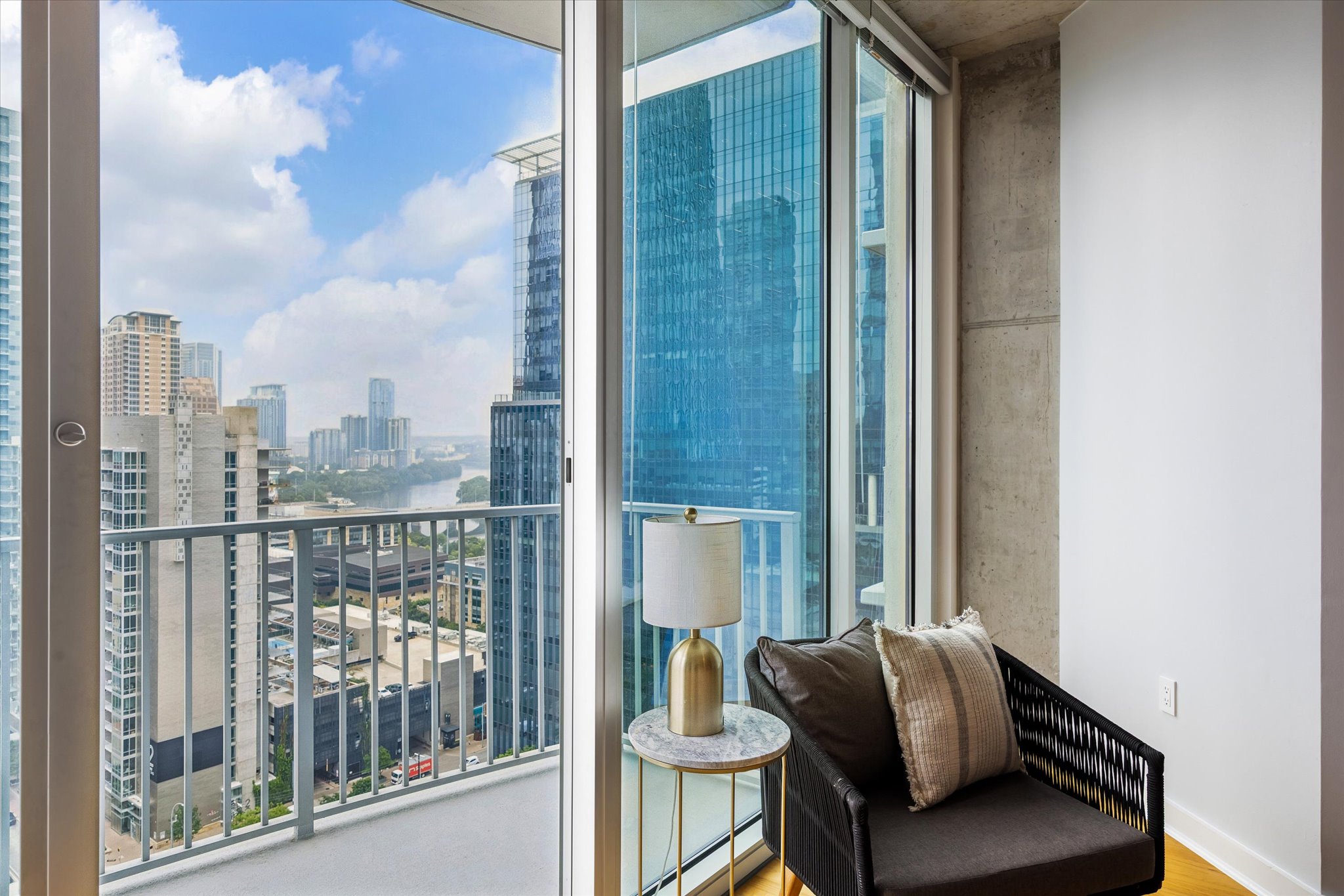 360 Nueces Street, Unit 2005 Austin, TX 78701 - Photo 22 of 37 Floor-to-ceiling sliding glass doors open to a private balcony.