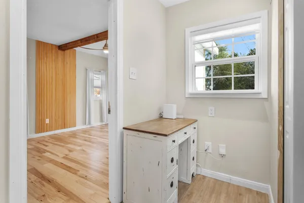 a view of kitchen with wooden floor and window