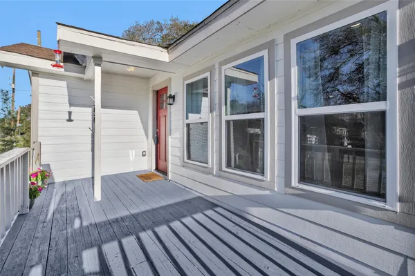 a view of outdoor space with deck and windows