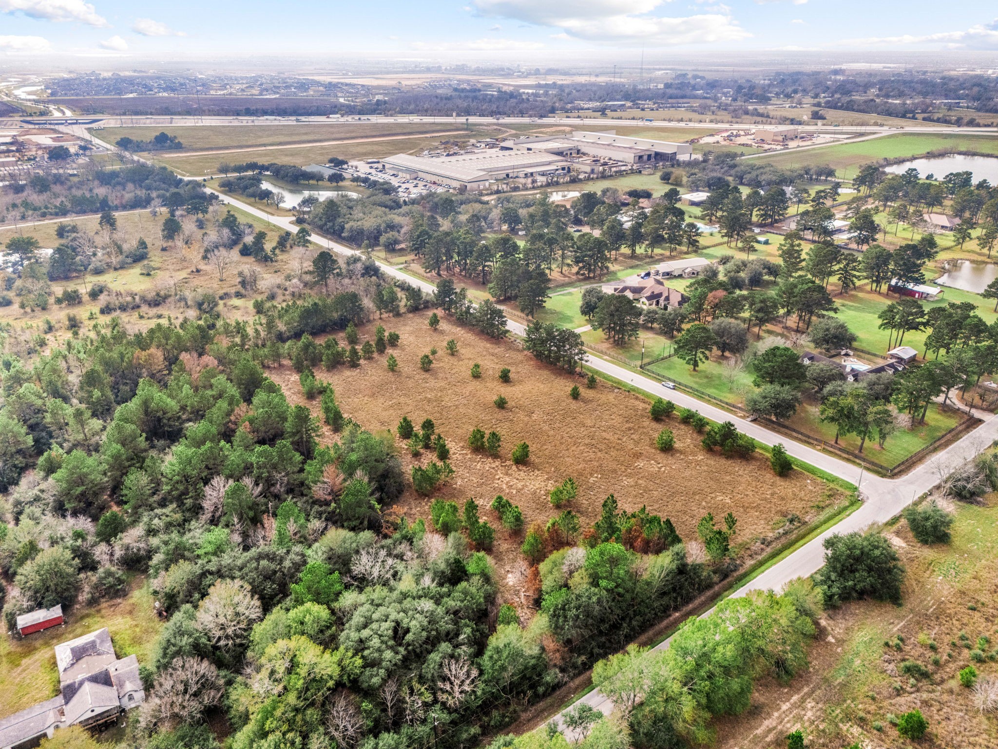 0 Badtke Road Hockley, TX 77447 - Photo 6 of 8 an aerial view of residential houses with outdoor space