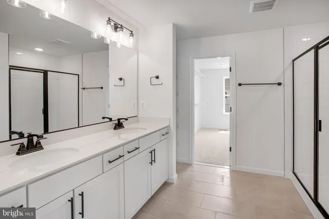 a view of a balcony with wooden floor and fence