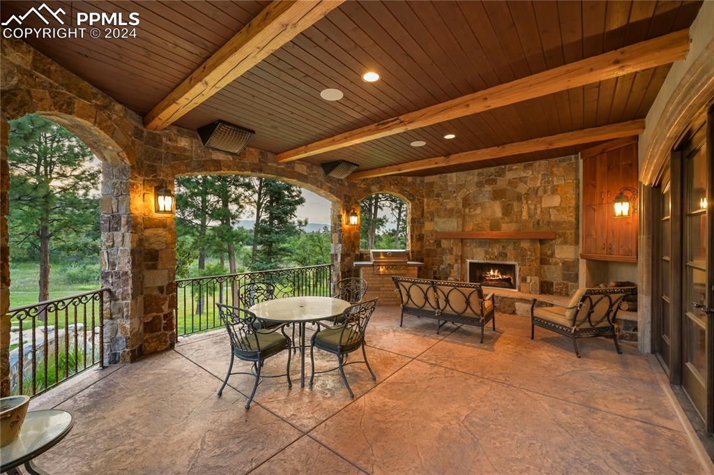 22 Crossland Road Colorado Springs, CO 80906 - Photo 12 of 49 a outdoor space with chairs a couch and a potted plant
