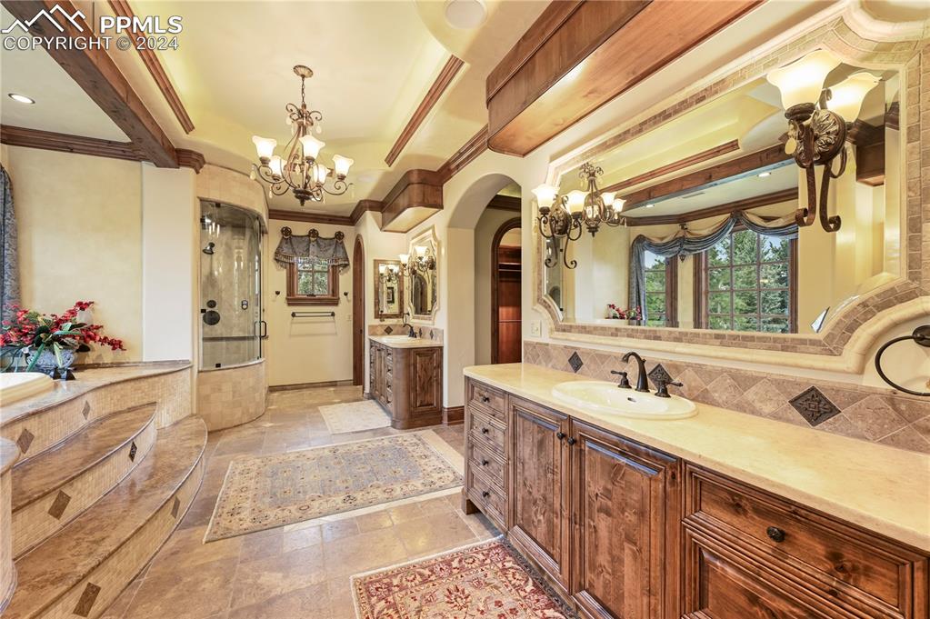 22 Crossland Road Colorado Springs, CO 80906 - Photo 20 of 49 a spacious bathroom with a double vanity sink mirror and