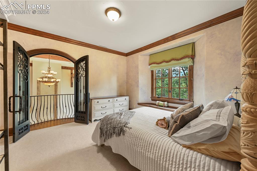 22 Crossland Road Colorado Springs, CO 80906 - Photo 24 of 49 a bedroom with a bed and a window