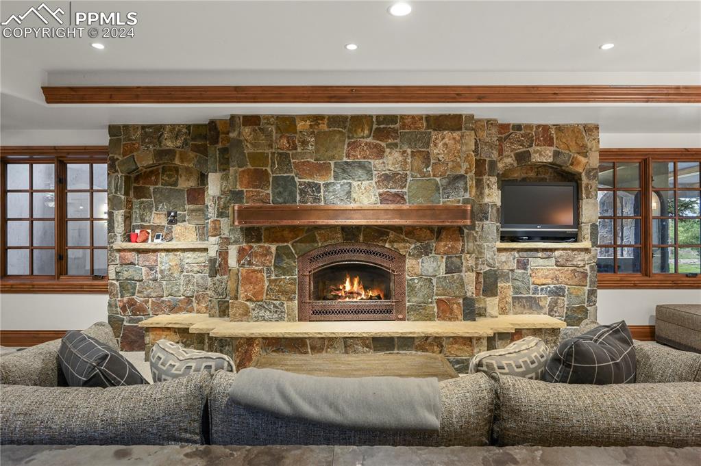 22 Crossland Road Colorado Springs, CO 80906 - Photo 31 of 49 a living room with fireplace furniture and a flat screen tv