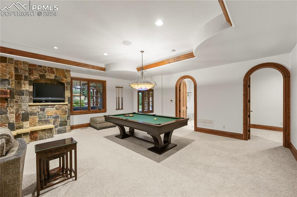 22 Crossland Road Colorado Springs, CO 80906 - Photo 32 of 49 a living room with furniture pool and flat screen tv