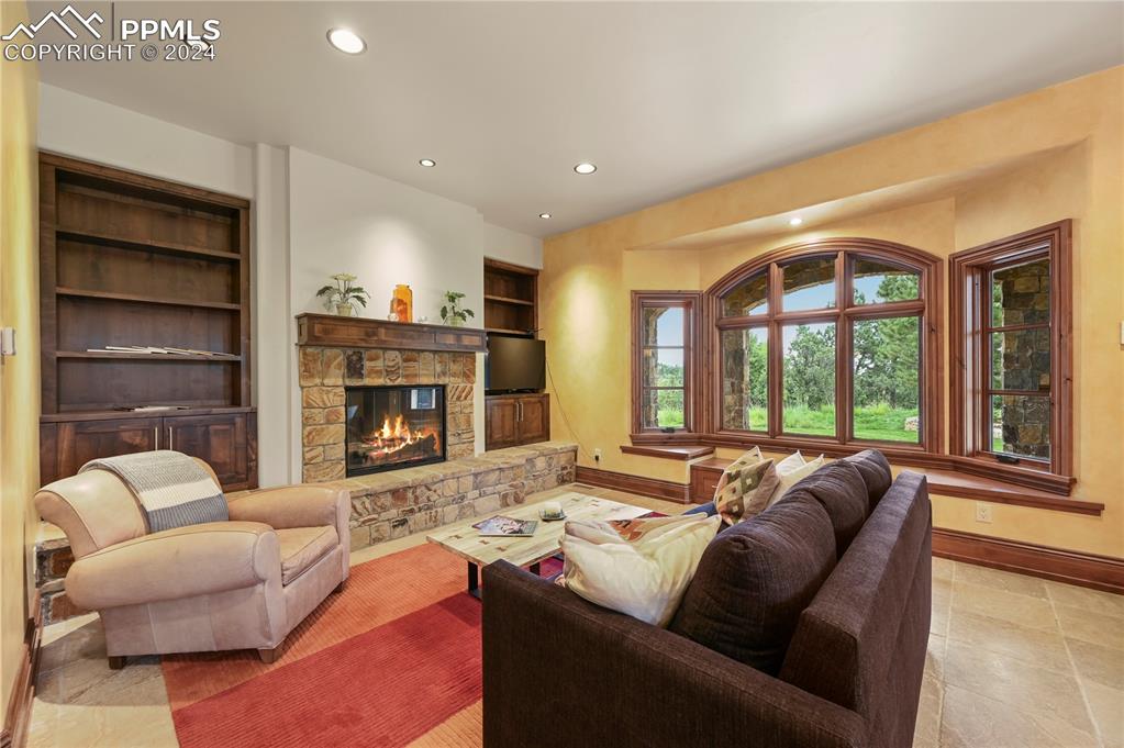 22 Crossland Road Colorado Springs, CO 80906 - Photo 42 of 49 a living room with furniture and a fireplace