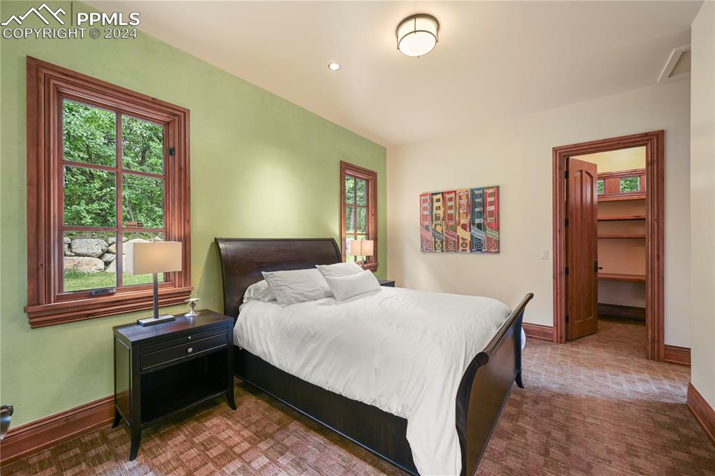 22 Crossland Road Colorado Springs, CO 80906 - Photo 44 of 49 a bedroom with a bed and a window