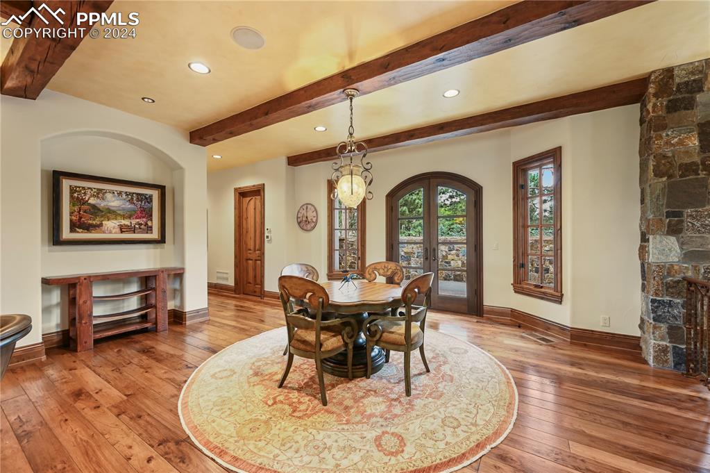 22 Crossland Road Colorado Springs, CO 80906 - Photo 10 of 49 a view of a dining room with furniture window and wooden floor