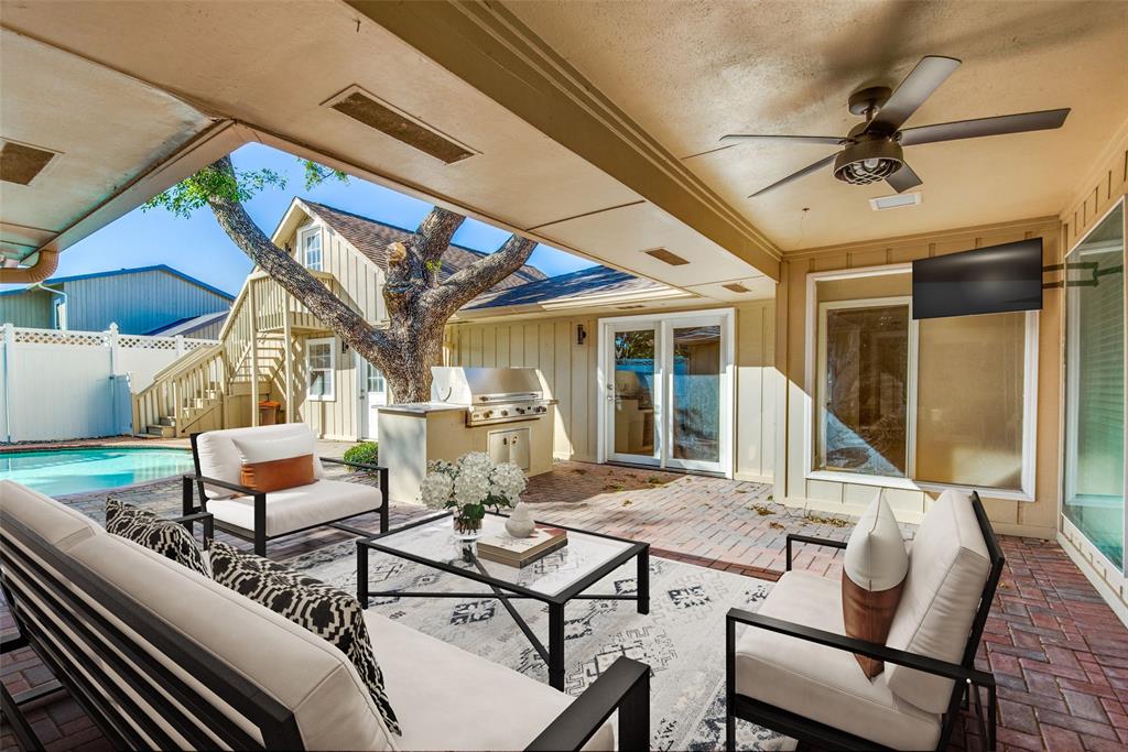 2700 Quail Ridge Drive Carrollton, TX 75006 - Photo 28 of 30 View of patio / terrace featuring an outdoor living space, a ceiling fan, an outdoor kitchen, and stairs