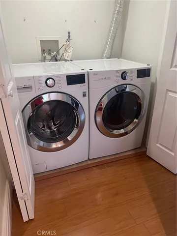 a kitchen with stainless steel appliances granite countertop a refrigerator stove and sink