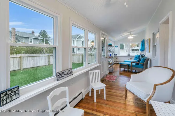 a living room with furniture and a yard
